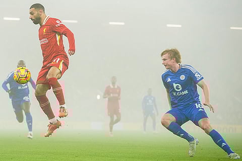 EPL 2024-25: Liverpool's Mohamed Salah controls a ball chased by Leicester's Victor Kristiansen