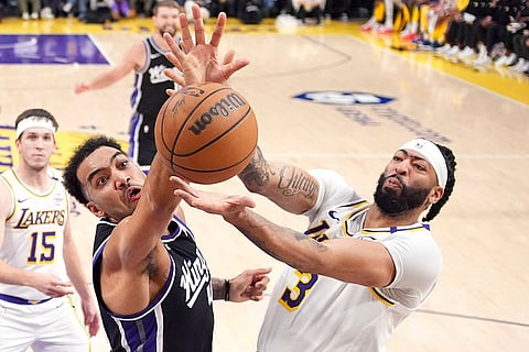 NBA: Kings forward Trey Lyles (41) and Los Angeles Lakers forward Anthony Davis (3) grapple for a rebound