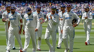 |Photo: AP : Indian players walk off the field during the Border-Gavaskar Trophy match against Australia.