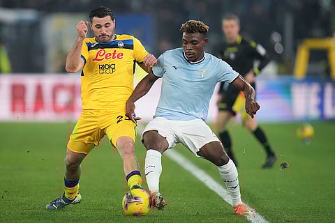 Serie A 2024-25: Sead Kolasinac, left, duels for the ball with Fisayo Dele-Bashiru