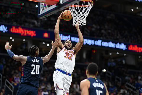 NBA: Knicks center Karl-Anthony Towns (32) goes to the basket for a dunk