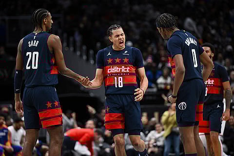 NBA: Wizards forward Kyshawn George (18) celebrates his putback basket