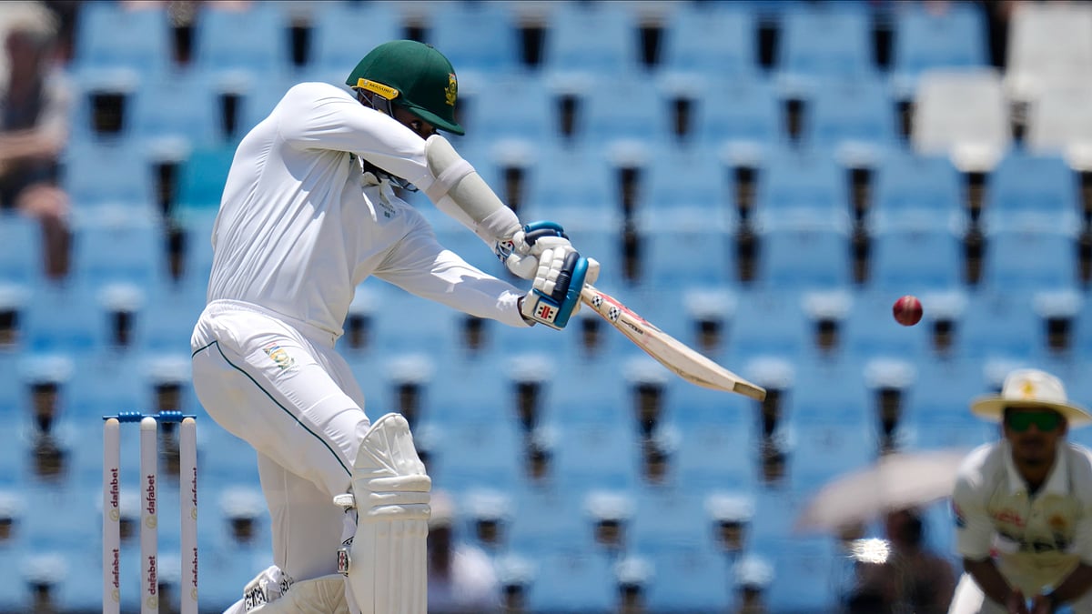 AP Photo/Themba Hadebe : South Africa's Kagiso Rabada plays a shot during day four of the Test cricket match between South Africa and Pakistan, at the Centurion Park in Centurion.