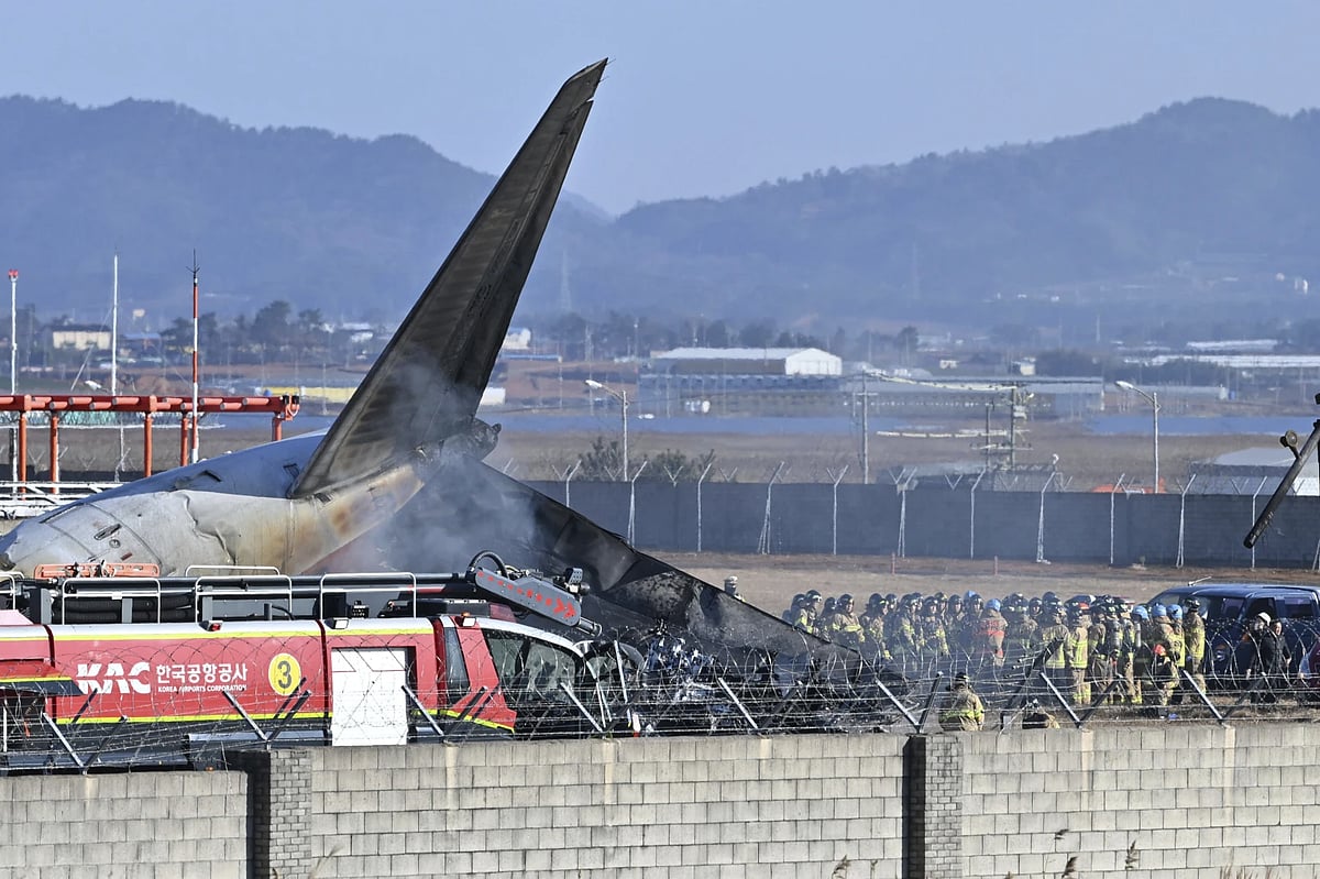 AP : Firefighters and rescue team members work on the runway of Muan International Airport in Muan, South Korea, Sunday, Dec. 29, 2024.