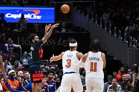 NBA: Wizards forward Justin Champagnie (9) shoots a three-point basket