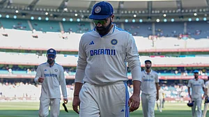 AP : India's skipper Rohit Sharma walks off with his teammates at stumps on day 4 of the 4th IND vs AUS Test