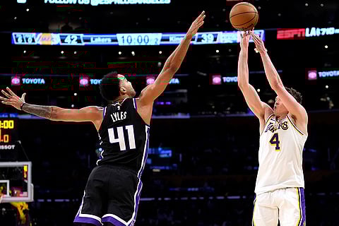 NBA: Lakers guard Dalton Knecht shoots as Kings forward Trey Lyles defends