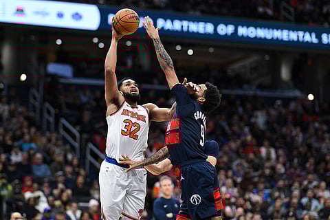 NBA: Knicks center Karl-Anthony Towns (32) shoots the ball against Wizards forward Justin Champagnie