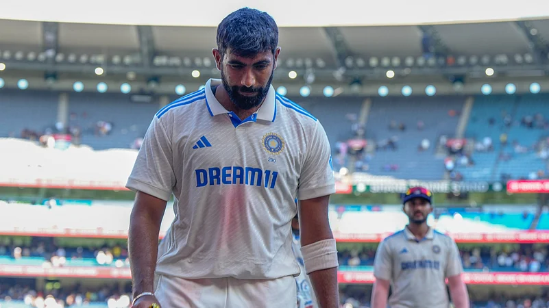 Indias Jasprit Bumrah walk off the field. AP Photo