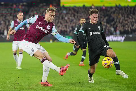 EPL 2024-25: West Ham's Jarrod Bowen, left, and Liverpool's Alexis Mac Allister vie for the ball