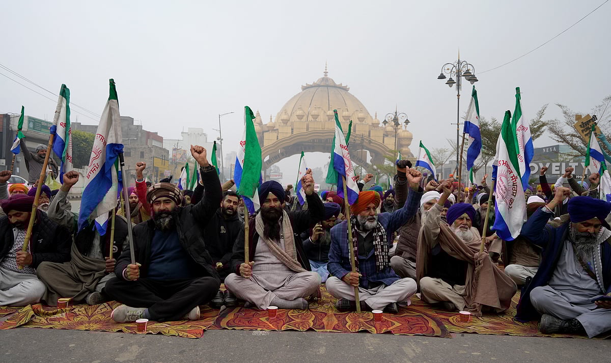 PTI : Farmers raise slogans as they block a road during the statewide 'bandh' called as part their ongoing protest, near Golden Gate, in Amritsar, Monday, Dec. 30, 2024.