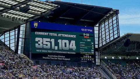 The scoreboard shows the official attendance on the last day of the fourth cricket test between Australia and India at the Melbourne Cricket Ground, Melbourne, Australia, Monday, Dec. 30, 2024.