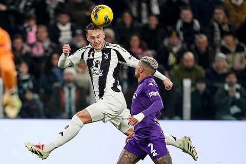 Serie A 2024-25: Juventus' Teun Koopmeiners and Fiorentina's Dodo challenge for the ball