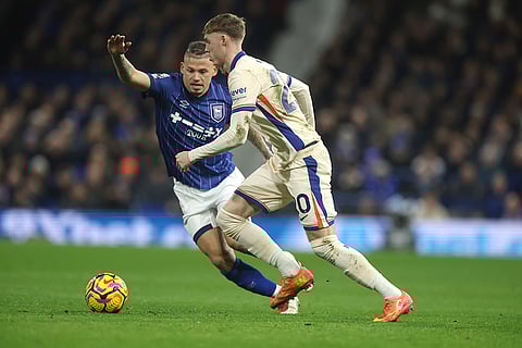 EPL 2024-25: Chelsea's Cole Palmer is challenged by Ipswich Town's Kalvin Phillips