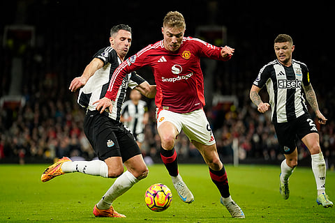 EPL 2024-25: Manchester United's Rasmus Hojlund, center, duels for the ball with Newcastle's Fabian Schaer
