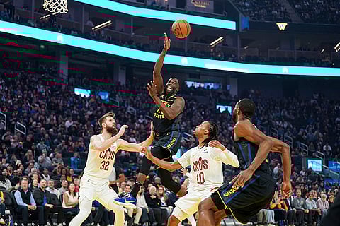 NBA 2024-25: Warriors forward Draymond Green, center, passes the ball