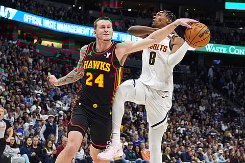 NBA 2024-25: Hawks guard Garrison Mathews knocks the ball out of the hands of Nuggets forward Peyton Watson