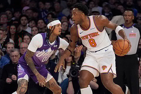 NBA 2024-25: Jazz's Jordan Clarkson (00) defends Knicks' OG Anunoby 