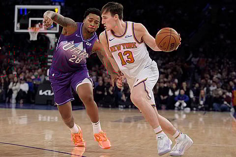 NBA 2024-25: Knicks' Tyler Kolek (13) drives past Utah Jazz's Brice Sensabaugh