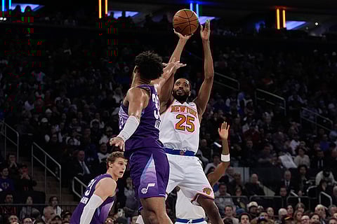 NBA 2024-25: Knicks' Mikal Bridges (25) shoots over Jazz's Johnny Juzang 