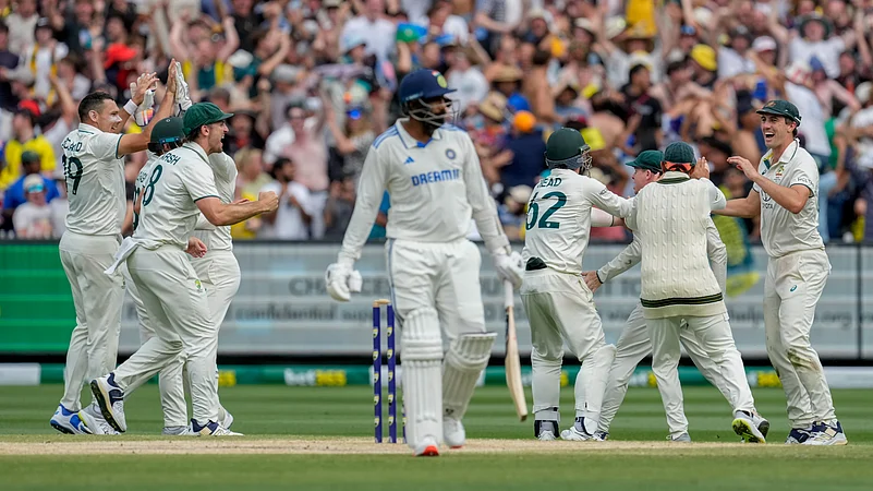 Australian players celebrates the wicket of Indias Jasprit Bumrah. AP Photo