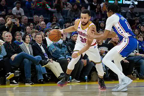 NBA 2024-25: Warriors guard Stephen Curry moves the ball