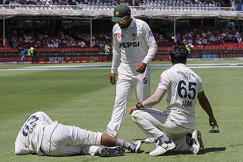 SA vs PAK 2nd test Day 1: Pakistan's Saim Ayub, left, sits injured on the ground