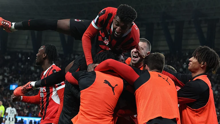 Milan celebrate their semi-final win - null