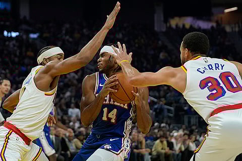 NBA 2024-25: 76ers guard Ricky Council IV (14) tries to move the ball