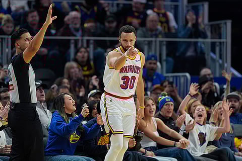 NBA 2024-25: Warriors guard Stephen Curry reacts after making a 3-point basket
