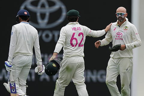 AUS vs IND 5th Test Day1: Australia's Nathan Lyon, right, is congratulated by Travis Head after taking the wicket of India's Shubman Gill