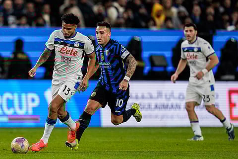 Italian Super Cup 2024-25: Atalanta's Ederson, left, runs with the ball next to Inter Milan's Lautaro Martinez