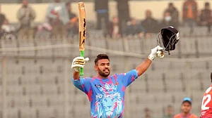 X/BCBtigers : Chittagong Kings batter Usman Khan celebrates his century at the BPL match.