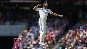 AP Photo/Mark Baker : India's Prasidh Krishna celebrates after taking the wicket of Australia's Beau Webster during play on the second day of the fifth cricket test between India and Australia at the Sydney Cricket Ground, in Sydney.