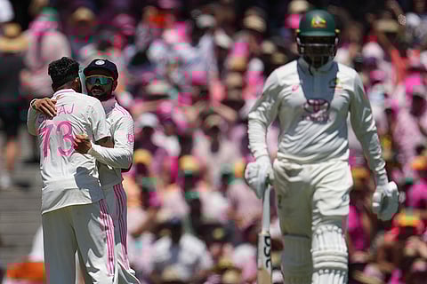 IND Vs AUS 5th Test Day 3: India's Mohammed Siraj, left, is congratulated by Virat Kohli after dismissing Australia's Usman Khawaja