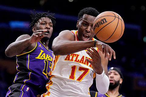 NBA 2024-25: Hawks forward Onyeka Okongwu and Lakers forward Dorian Finney-Smith go after a loose ball