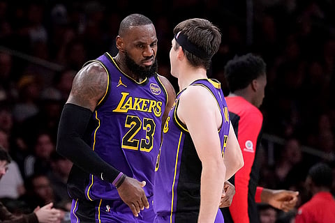 NBA 2024-25: Lakers forward LeBron James, left, celebrates with guard Austin Reaves after making his 30th point of the game