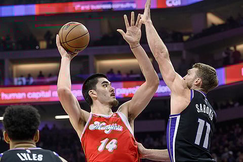 NBA 2024-25: Grizzlies center Zach Edey (14) shoots over Kings forward Domantas Sabonis