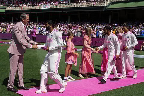 IND Vs AUS 5th Test Day 3: Former Australian cricketer Glenn McGrath, left, takes pink caps from the Indian team