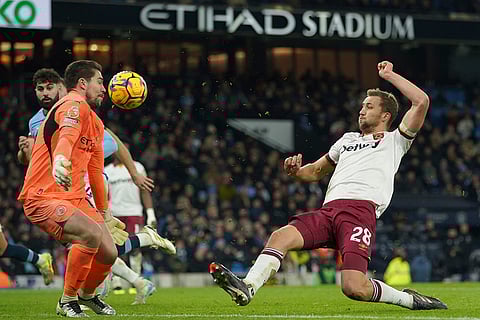 EPL 2024-25: West Ham's Tomas Soucek and Manchester City's goalkeeper Stefan Ortega battle for the ball