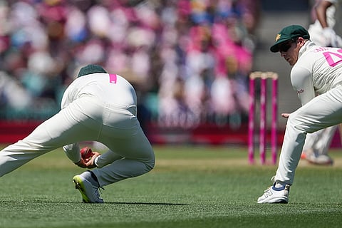 IND Vs AUS 5th Test Day 3: Australia's Usman Khawaja, left, takes a catch to dismiss India's Mohammed Siraj