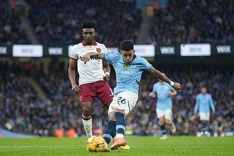 EPL 2024-25: Manchester City's Savinho, front, kicks a ball chased by West Ham's Mohammed Kudus 