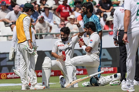 SA vs PAK 2nd Test Day 3: Pakistan's Mohammad Rizwan, centre, receives medical attention after being struck by the ball