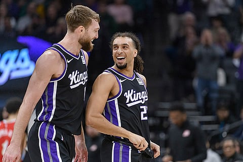 NBA 2024-25: Kings forward Domantas Sabonis, left, greets Kings guard Devin Carter