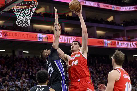 NBA 2024-25: Grizzlies center Zach Edey (14) shoots over Sacramento Kings center Alex Len