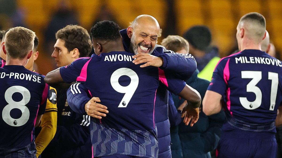 Nuno Espirito Santo celebrates with Taiwo Awoniyi on Monday at Molineux