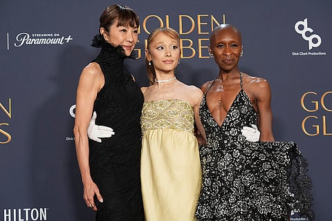 Michelle Yeoh, from left, Ariana Grande, and Cynthia Erivo