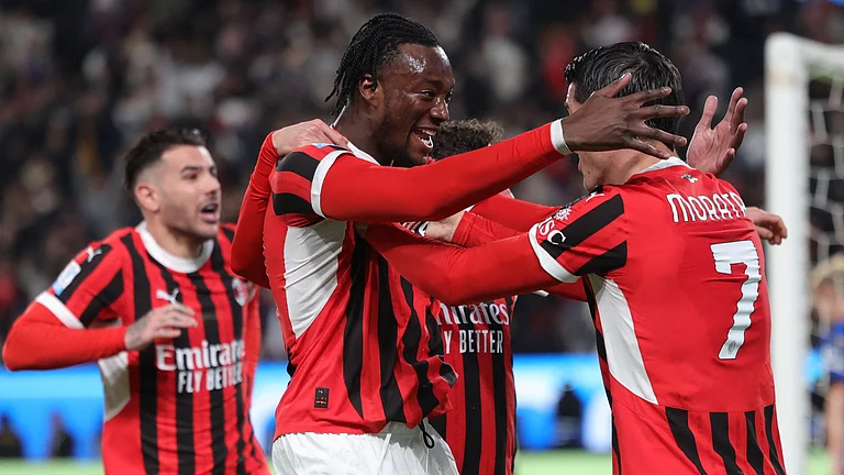 Abraham celebrates after scoring Milan's winner - null