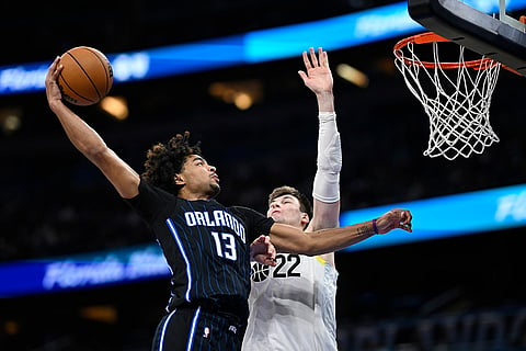 NBA 2024-25: Magic guard Jett Howard (13) goes up to dunk