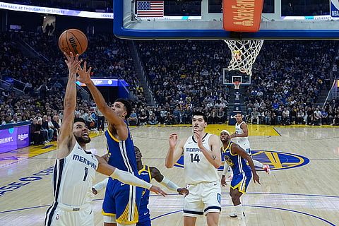NBA 2024-25: Grizzlies guard Scotty Pippen Jr. (1) shoots while defended by Warriors center Trayce Jackson-Davis